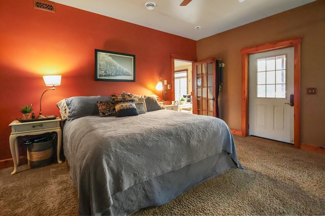 bedroom featuring ceiling fan, carpet, and visible vents