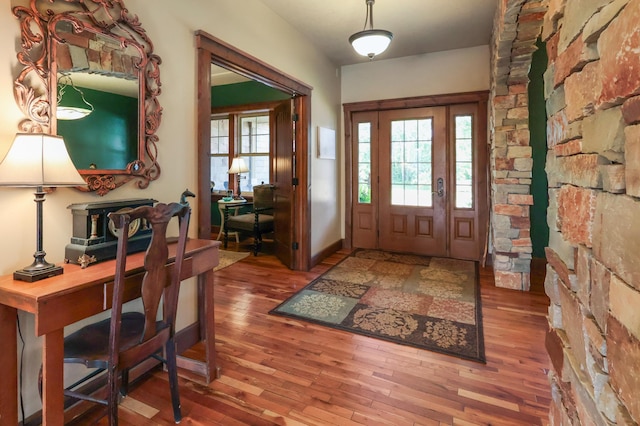 entrance foyer featuring wood finished floors and baseboards