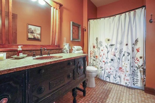 full bathroom featuring vanity, toilet, and tile patterned floors