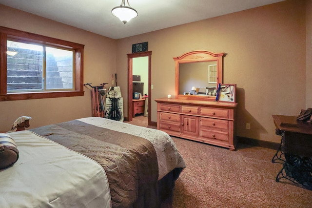 carpeted bedroom with baseboards