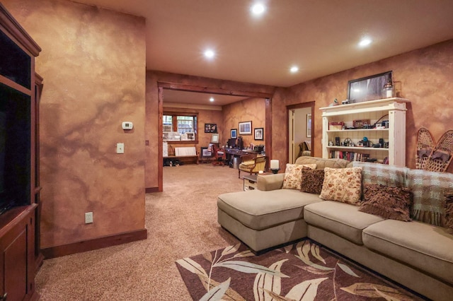 living room featuring light carpet, baseboards, and recessed lighting