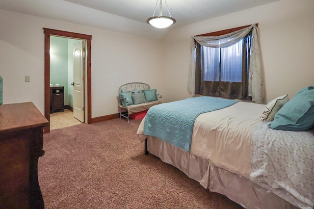 bedroom with carpet flooring, baseboards, and ensuite bathroom