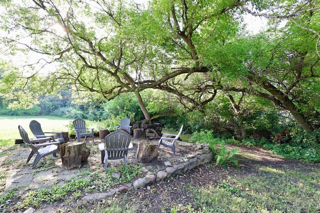 view of yard with a fire pit