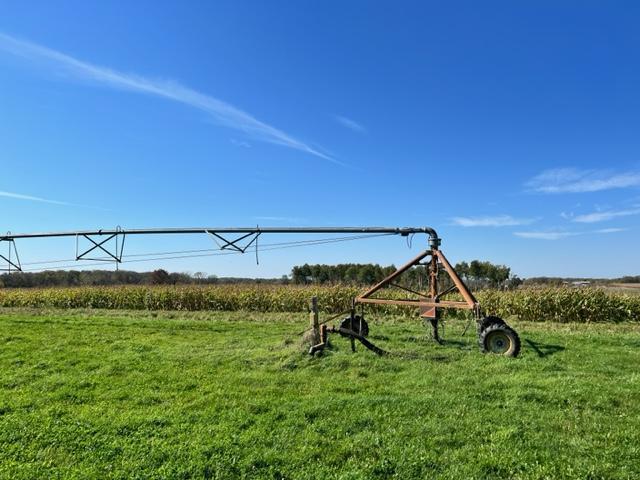 view of home's community featuring a lawn and a rural view