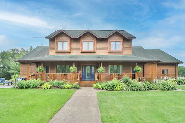 view of front of house with a front yard and a porch