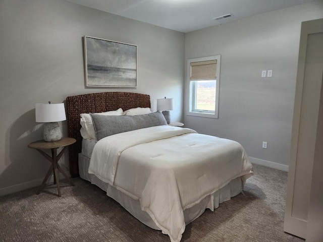 carpeted bedroom with visible vents and baseboards
