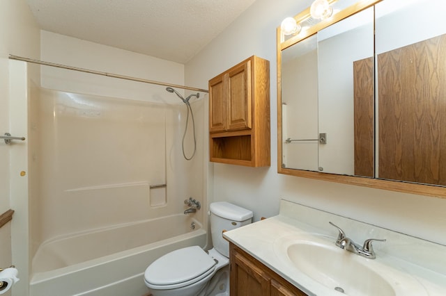 full bathroom with vanity, toilet, washtub / shower combination, and a textured ceiling