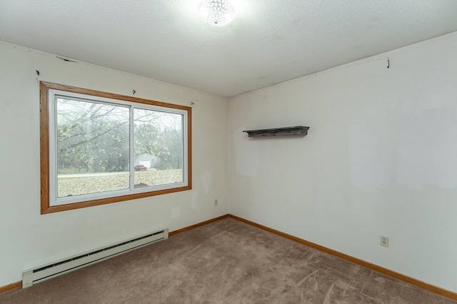 spare room with light carpet, a textured ceiling, and a baseboard radiator