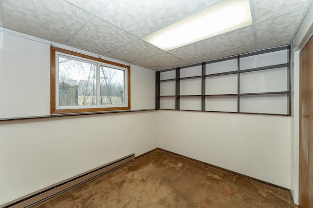 interior space with carpet floors and baseboard heating