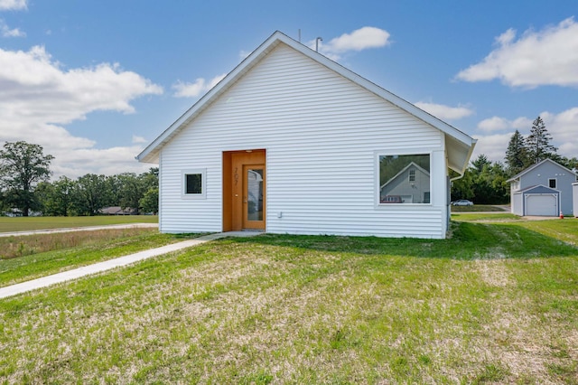 rear view of house with a yard