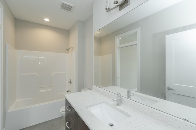 full bathroom featuring vanity, tile patterned flooring, toilet, and shower / bathtub combination