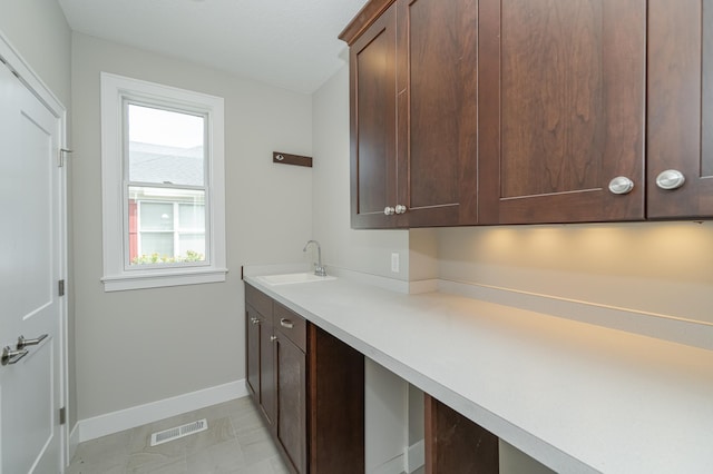 laundry area with sink