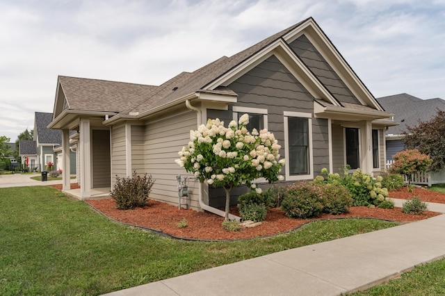 view of side of property featuring a yard