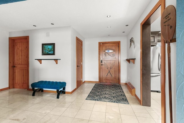 foyer with light tile patterned flooring