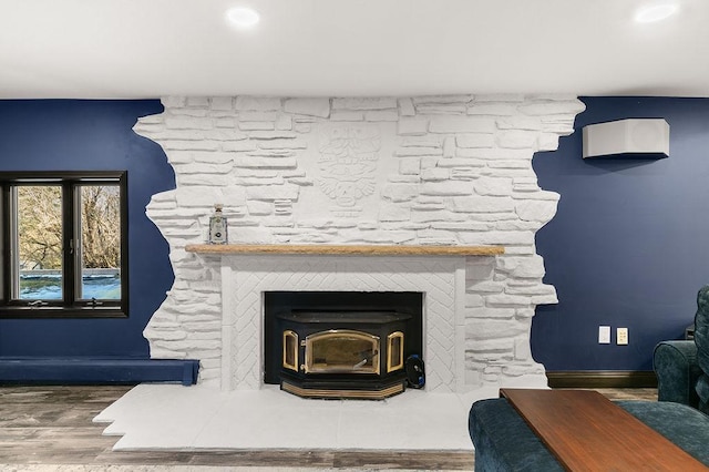 room details with wood-type flooring and a fireplace