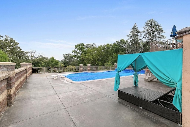 view of pool featuring a patio area