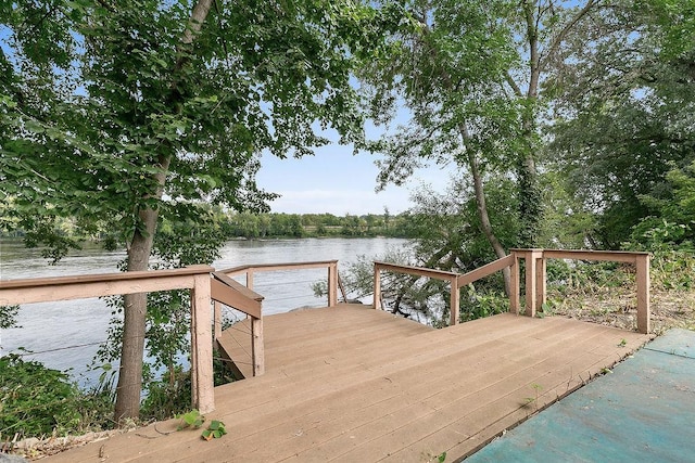 dock area with a deck with water view