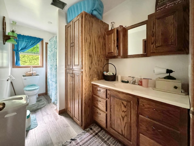 interior space with light hardwood / wood-style flooring and sink