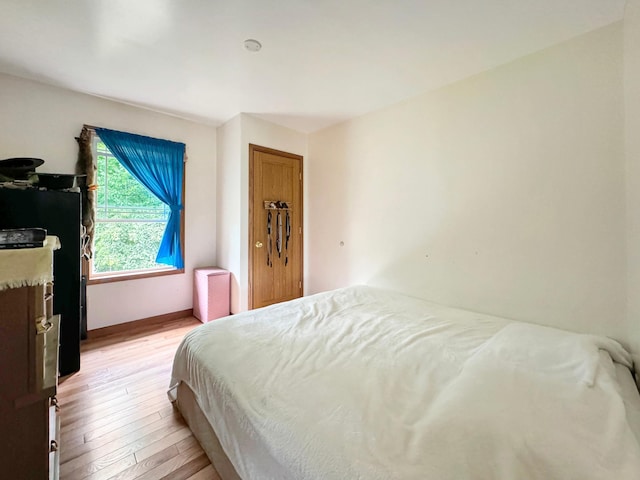 bedroom with light wood-type flooring