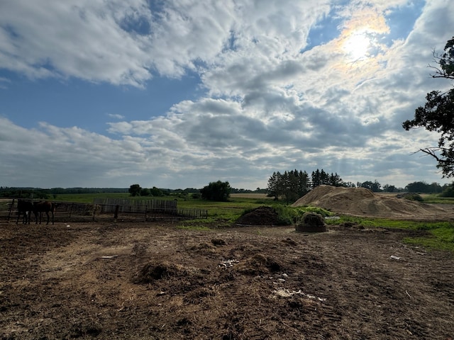 view of yard with a rural view