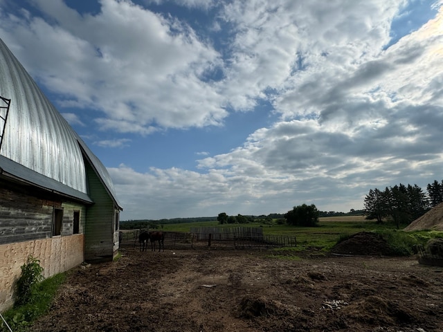 view of yard with a rural view