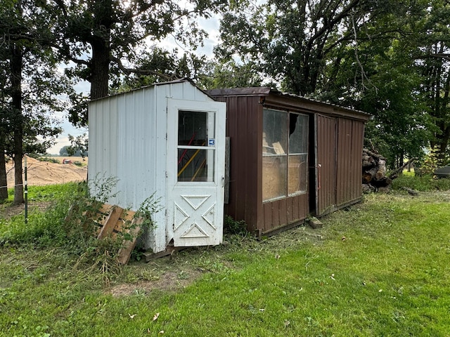 view of outbuilding with a lawn