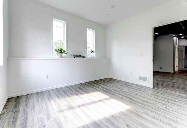 unfurnished room featuring light hardwood / wood-style flooring