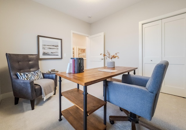 office area featuring light colored carpet