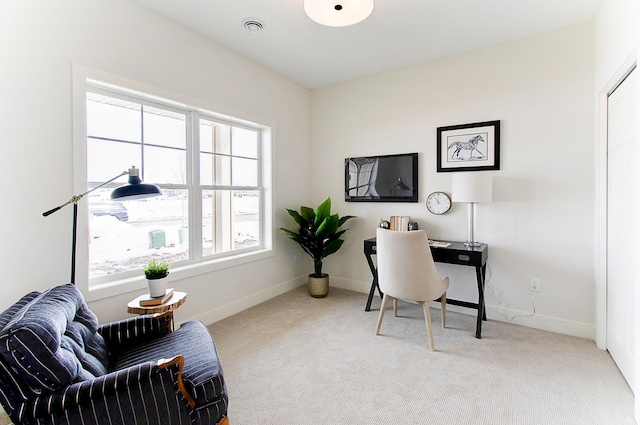 office space with carpet flooring, visible vents, and baseboards