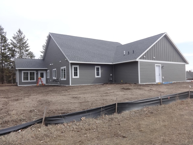 981 White Spruce Ln NW, Alexandria, MN 56308 - rear view of house featuring a shingled roof and board and batten siding
