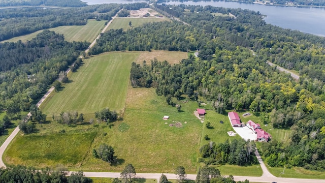 birds eye view of property with a water view and a rural view