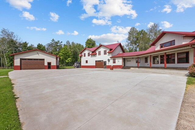 view of front of house with an outbuilding and a garage