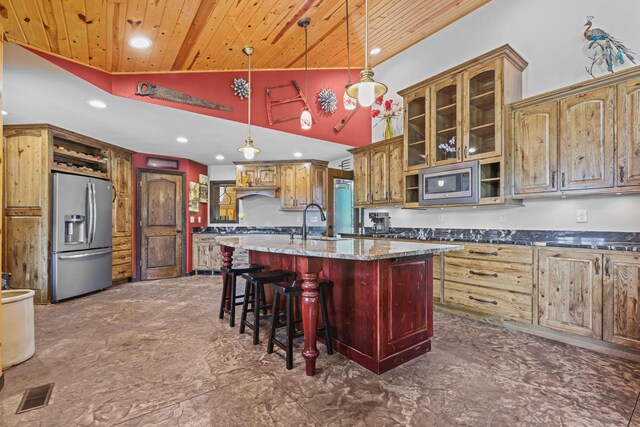 kitchen with wood ceiling, stainless steel appliances, decorative light fixtures, high vaulted ceiling, and a center island with sink