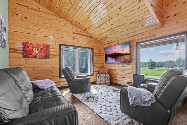 living room featuring wood ceiling, wooden walls, and a wealth of natural light