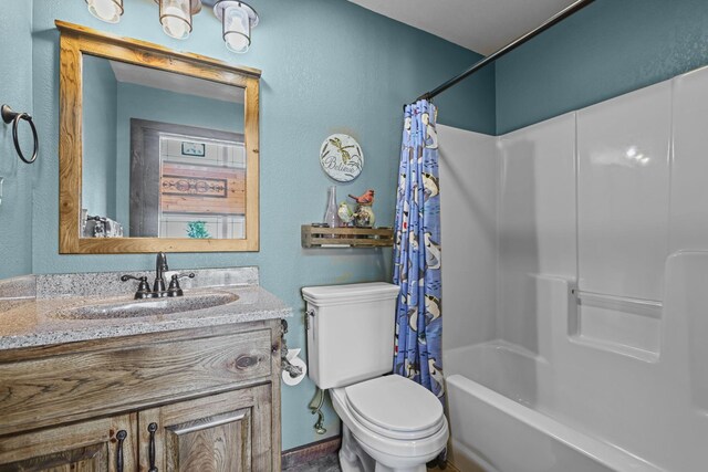 full bathroom with vanity, toilet, and shower / tub combo with curtain