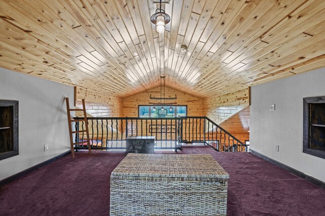 interior space with wood walls, carpet floors, and wooden ceiling