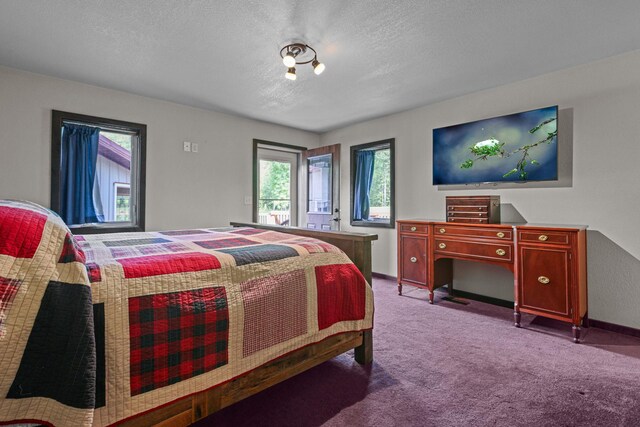 carpeted bedroom featuring a textured ceiling