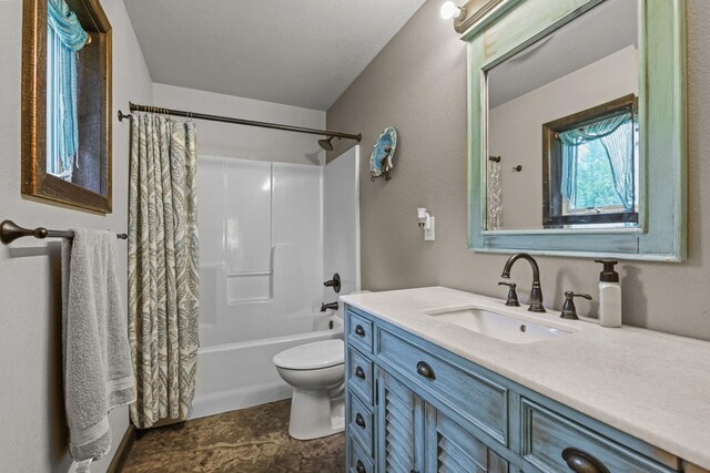 full bathroom featuring toilet, shower / bath combo, and vanity