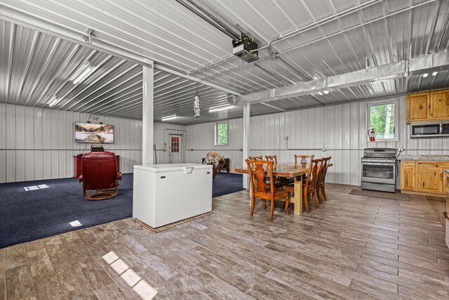 interior space featuring light hardwood / wood-style flooring and stainless steel appliances