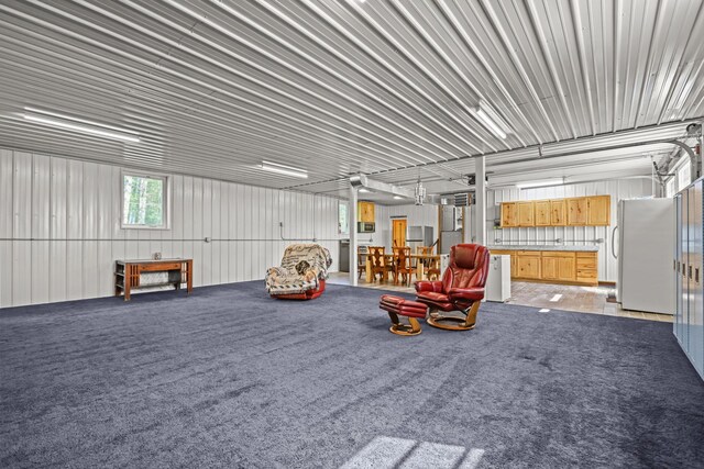 garage featuring white fridge