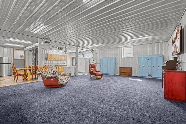 garage featuring stainless steel fridge