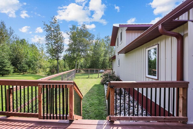 wooden terrace with a yard