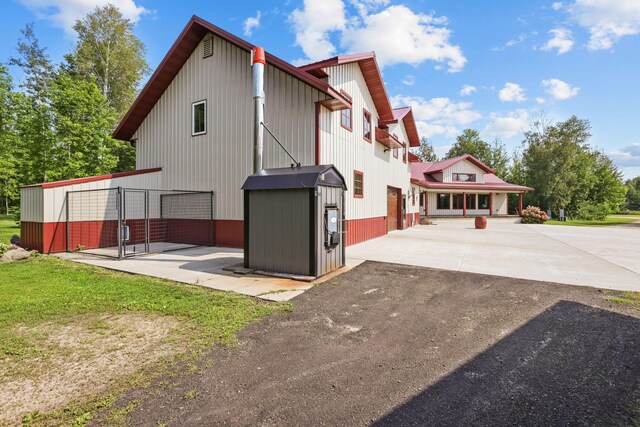 back of house with a garage