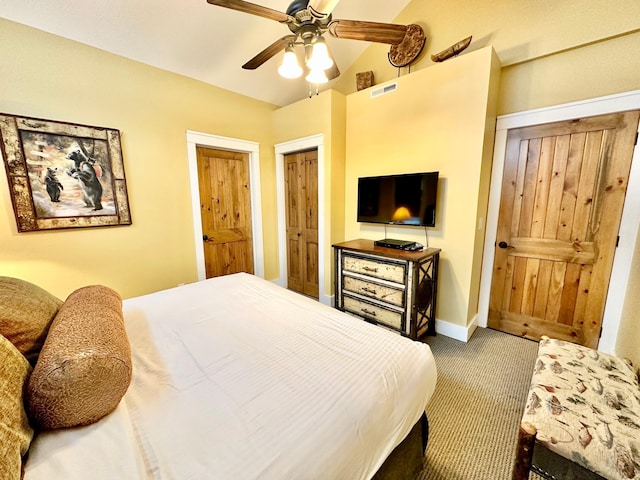 bedroom with carpet flooring, vaulted ceiling, and ceiling fan