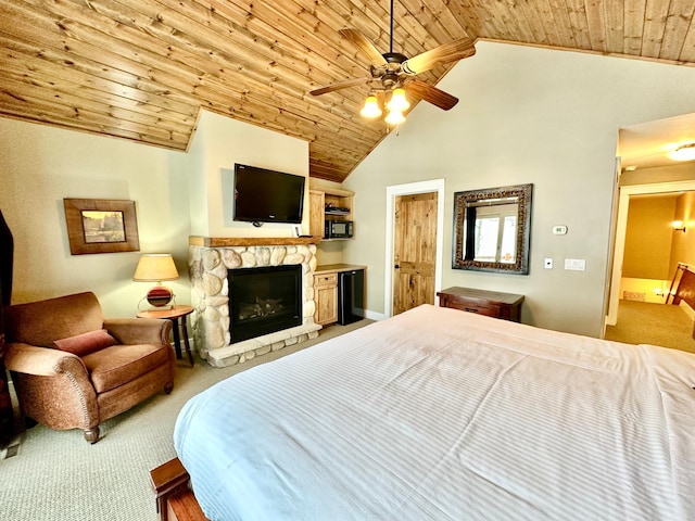 bedroom featuring wood ceiling, ceiling fan, high vaulted ceiling, a fireplace, and light colored carpet