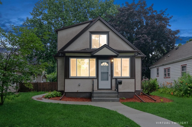 view of front of home with a lawn