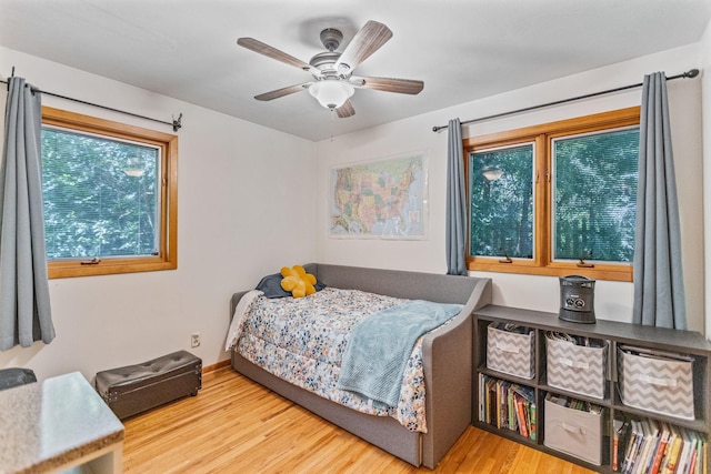 bedroom with ceiling fan and light wood finished floors