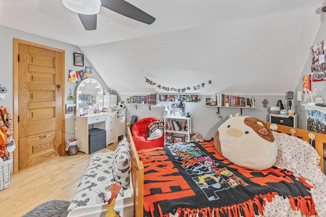 bedroom featuring vaulted ceiling, ceiling fan, and wood finished floors