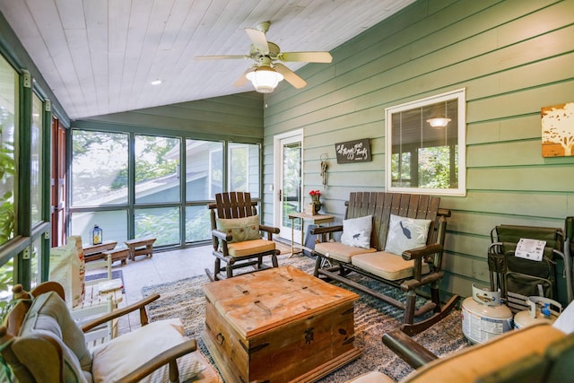 sunroom / solarium with lofted ceiling, wood ceiling, and ceiling fan