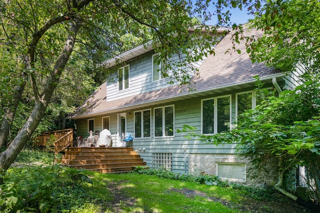 view of front of house with roof with shingles